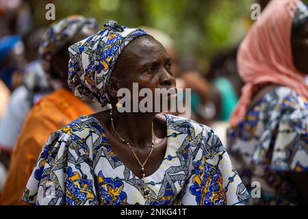 Agboville, Ivory Coast. 23rd Feb, 2023. A harvest worker sits on a cocoa plantation. Federal Minister of Labor Heil and Federal Minister for Economic Cooperation and Development Schulze visit Ghana and Côte d'Ivoire. Credit: Christophe Gateau/dpa/Alamy Live News Stock Photo