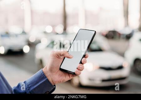 Hand of businessman using smart phone at street Stock Photo