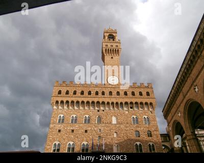 Clock tower, in Palazzo Vecchio's Arnolfo Tower, viewed from a side street, Florence, Italy Stock Photo