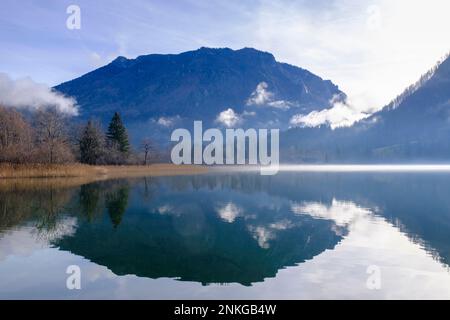 Austria, Lower Austria, Lunz am See, Scheiblingstein mountain reflecting in Lunzer See lake Stock Photo