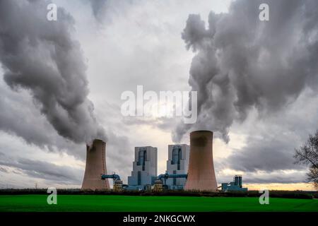 Germany, North Rhine Westphalia, Grevenbroich, Water vapor rising from cooling towers of lignite-fired power station Stock Photo
