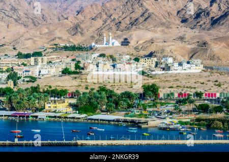 Seaport near Sheikh Zayed Mosque at Aqaba on sunny day Stock Photo