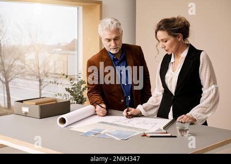 Mature fashion designers working together in studio Stock Photo