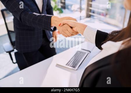 Recruiter and candidate doing handshake after interview at office Stock Photo