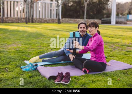 Happy mature couple taking selfie through smart phone Stock Photo