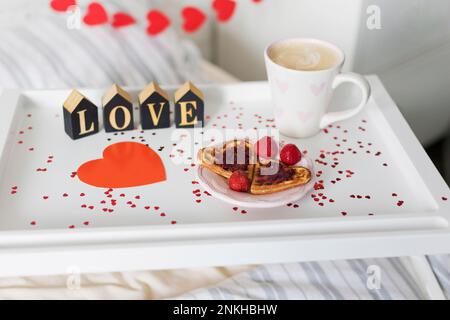 Love text by heart shape in breakfast tray Stock Photo