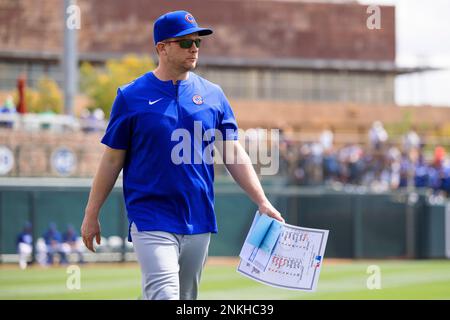 Chicago Cubs bench coach Andy Green, left, wearing a face mask, talks with Codi  Heuer before a baseball game against the Pittsburgh Pirates Friday, Sept.  3, 2021, in Chicago. Green will skipper