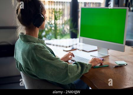 Freelancer working on desktop PC at home office Stock Photo