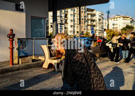 Izmir, Turkey. 23rd Feb, 2023. An elderly woman seen walking on the street. While the east of Turkey was trying to heal the wounds of the earthquake, people started walking on the streets as the weather warmed up in Izmir, the west of the country. (Photo by Murat Kocabas/SOPA Images/Sipa USA) Credit: Sipa USA/Alamy Live News Stock Photo