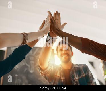 happy employees giving each other high five Stock Photo - Alamy