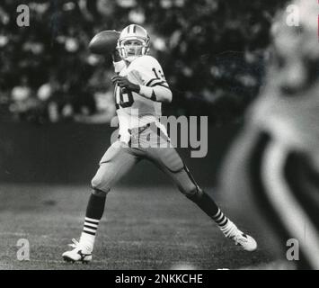 Quarterback Joe Montana passes on the run against the Cincinnati