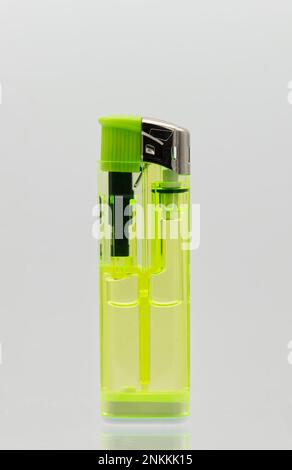 Yellow transparent lighter isolated on white background. Stock Photo