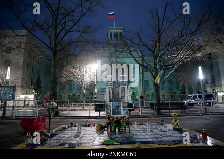 Berlin, Germany. 24th Feb, 2023. In front of the Russian Embassy Unter den Linden flowers and a wall with photos are placed in memory of the Russian war of aggression on Ukraine one year ago. The Russian army had invaded Ukraine on 24.02.2022 Credit: Carsten Koall/dpa/Alamy Live News Stock Photo