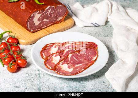 Beef ribeye bacon. Dried Turkish pastrami slices in plate. Traditional Turkish delicacies Stock Photo