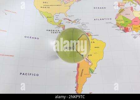 Crystal ball on a world map that highlights a country to highlight it as a magnifying glass and note its economic and financial importance: Peru Stock Photo