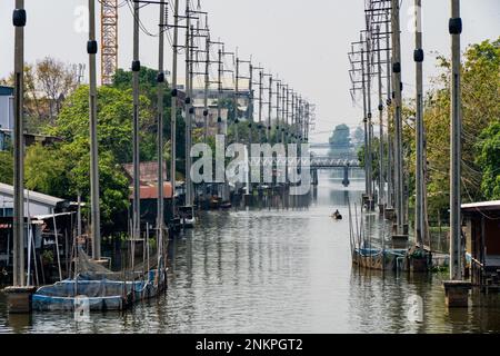 Lad Krabang, Thailand, 24/02/2023, A fishing boat drives up the canal. Daily life around Lad Krabang, a residential district near Suvarnabhumi International Airport, in East Bangkok, Thailand, on February 24, 2022. Stock Photo