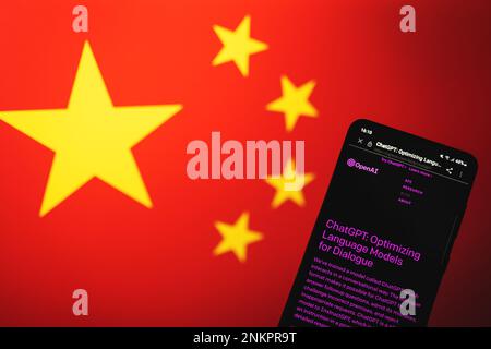 ChatGPT Open AI chat bot page on phone screen with China flag background. China bans Chat GPT access concept. Swansea, UK - February 21, 2023. Stock Photo