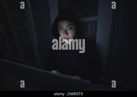 Laptop, hacker and server with portrait of woman for coding, software and cyber security. Ransomware, phishing and developer with girl programmer Stock Photo