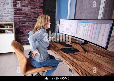 Back Pain Bad Posture Woman Sitting In Office Stock Photo