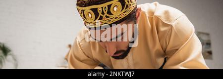 Muslim man praying during ramadan at home, banner,stock image Stock Photo