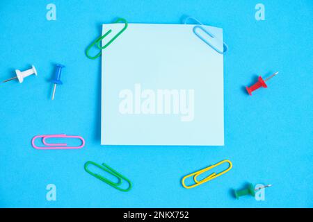 Blue paper stickers for writing notes on a blue background Stock Photo