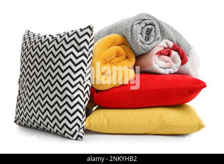 Stylish soft pillows and blankets on white background Stock Photo