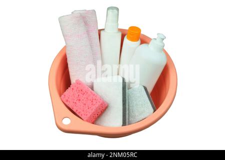 Housecleaning products. Detergent bottles with washcloths in a pink basin. Isolate on a white background. Top view. Stock Photo