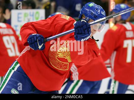 Vancouver Canucks' Elias Pettersson wears a commemorative jersey in honor  of the First Nations as players warm up for an NHL hockey game against the  St. Louis Blues on Wednesday, March 30