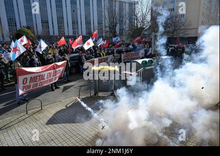 Smoke flares in the mobilization called by CIG-Industria, of metal workers,  from the Plaza de Vigo to the headquarters of the Confederation of  Employers in Plaza Luis Seoane, on January 15, 2022