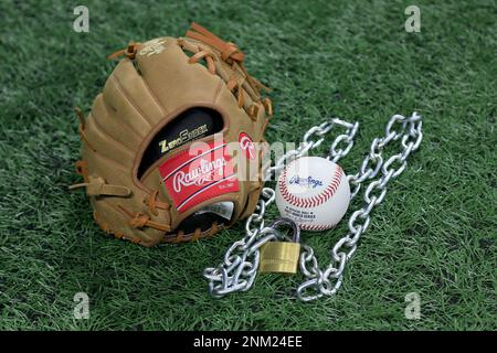 Atlanta, GA - January 09: An Official Rawlings Major League baseball sits  with a glove, lock and chain to represent the lockout between Major League  Baseball (MLB) and the Major League Baseball