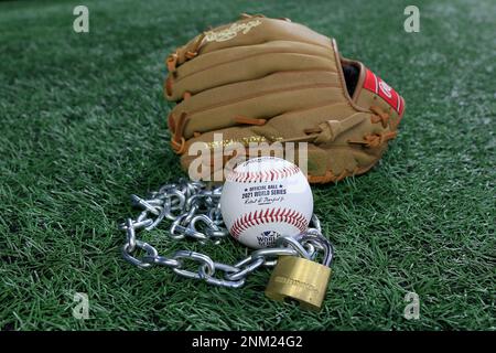 Atlanta, GA - January 09: An Official Rawlings Major League baseball sits  with a glove, lock and chain to represent the lockout between Major League  Baseball (MLB) and the Major League Baseball