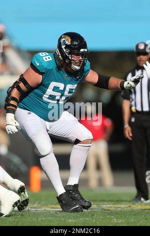 Jacksonville Jaguars offensive tackle KC McDermott (62) blocks