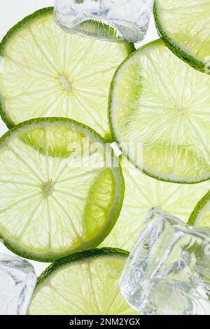 Slices Limes with ice cubes Stock Photo