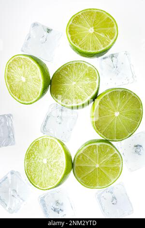 Slices Limes with ice cubes Stock Photo
