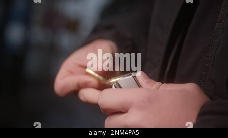 Man Hands Loading Ammunition into Magazine Clip Stock Photo