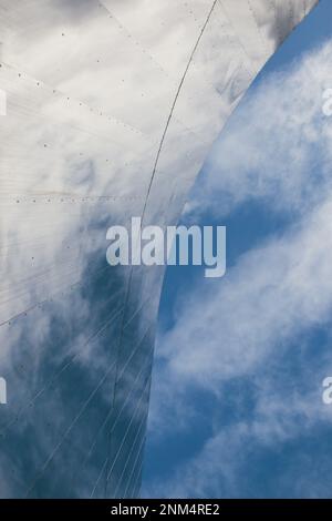 Minimalist low angle view of modern apartment building with vibrant red ...