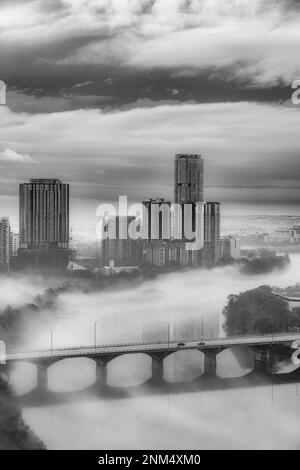 Foggy morning  B&W view of Congress Bridge across Ladybird Lake in Austin, Texas. Stock Photo