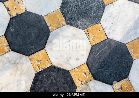 close up of pattern of marble floor with square and octagonal tiles in different colours Stock Photo