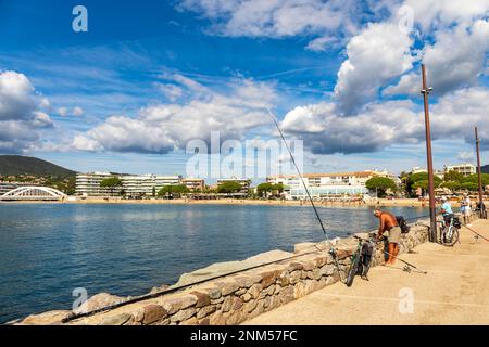 Fishermen in Sainte Maxime harbour, French Riviera Stock Photo