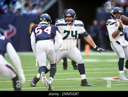 HOUSTON, TX - DECEMBER 12: Seattle Seahawks DE Darrell Taylor watches  action during game featuring the Houston Texans and the Seattle Seahawks on  December 12, 2021 at NRG Stadium in Houston, TX. (