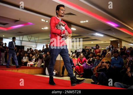 Dhaka, Bangladesh. 24th Feb, 2023. A cat ramp show was held at Jamuna Future Park in Dhaka, Bangladesh on Friday (February 24). More than 3,000 cat lovers have registered for the event this year. They all came to the event with their pet cats. Through this event, everyone who came here urged everyone to be aware of the animals around them. (Credit Image: © Md. Rakibul Hasan/ZUMA Press Wire) EDITORIAL USAGE ONLY! Not for Commercial USAGE! Credit: ZUMA Press, Inc./Alamy Live News Stock Photo