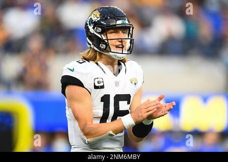 Jacksonville Jaguars quarterback Trevor Lawrence (16) drinks off of a  Gatorade bottle before an NFL football game against the Los Angeles Rams  Sunday, Dec. 5, 2021, in Inglewood, Calif. (AP Photo/Kyusung Gong