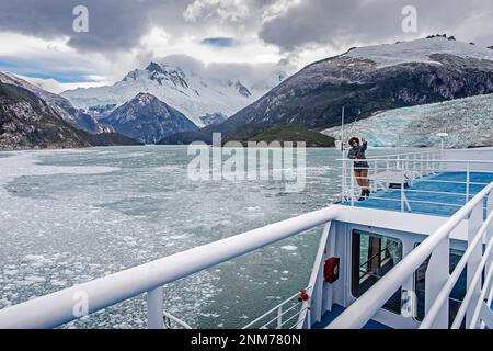 Woman,Tourist, selfie, Pia Fjord and Pia Glacier from Ventus cruise ship, in Beagle Channel (northwest branch), PN Alberto de Agostini, Tierra del Fue Stock Photo