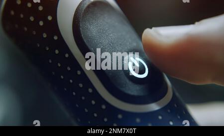 Power button a finger pressing to power button, energy and technology concept Stock Photo