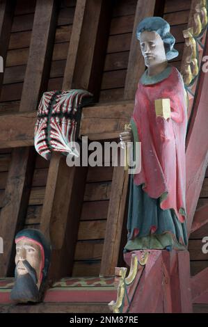 Oak figure of The Apostle Saint Simon Zelotes. One of twelve carvings representing Jesus’ disciples in St John the Baptist Church, Bere Regis, Dorset. Stock Photo