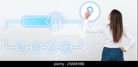 Businesswoman in white office sirt standing and pressing virtual button with her finger. Women presenting new technologies for future. Futuristic Stock Photo