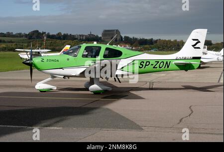 A Cirrus SR22T-GTS G6 Carbon light aircraft on the ramp at Brighton City Airport Sussex England Stock Photo