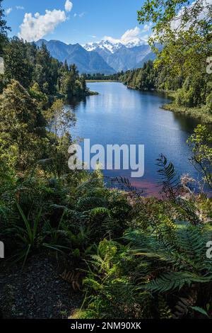 Known as the 'View of Views' - Lake Matheson and view towards Mt Tasman in the Aoraki/Mt Cook National Park, Fox Glacier, South Island, New Zealand Stock Photo
