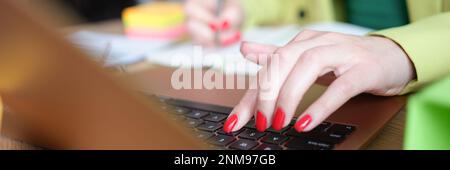 Closeup of busy woman working from home Stock Photo