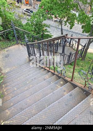 aerial view of rusty stairs, rusty metal stairs going down, rusty iron steps and handrails. Example of steampunk retro style interior part with copysp Stock Photo